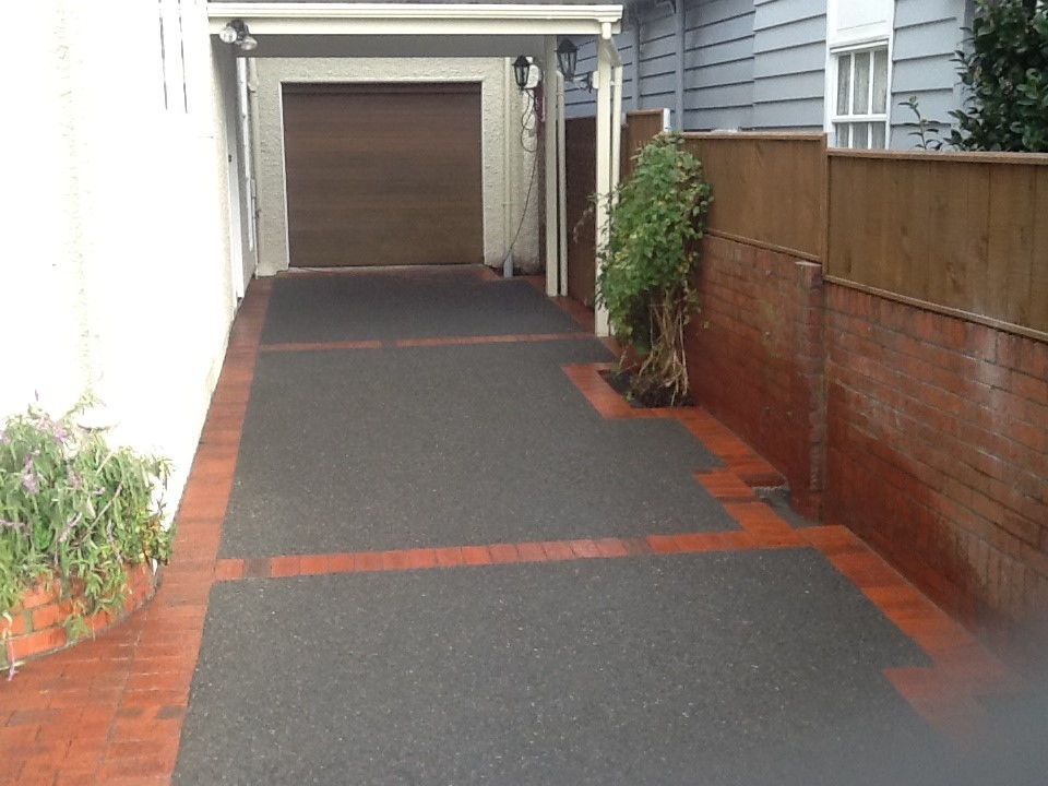 Long driveway with contrasting brick paving detail